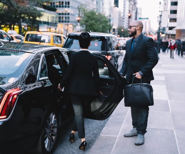 successful-business-partners-getting-in-car-at-cit-2024-05-28-17-44-19-utc-1.jpg